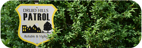 Druid Hills Patrol yard sign in foliage